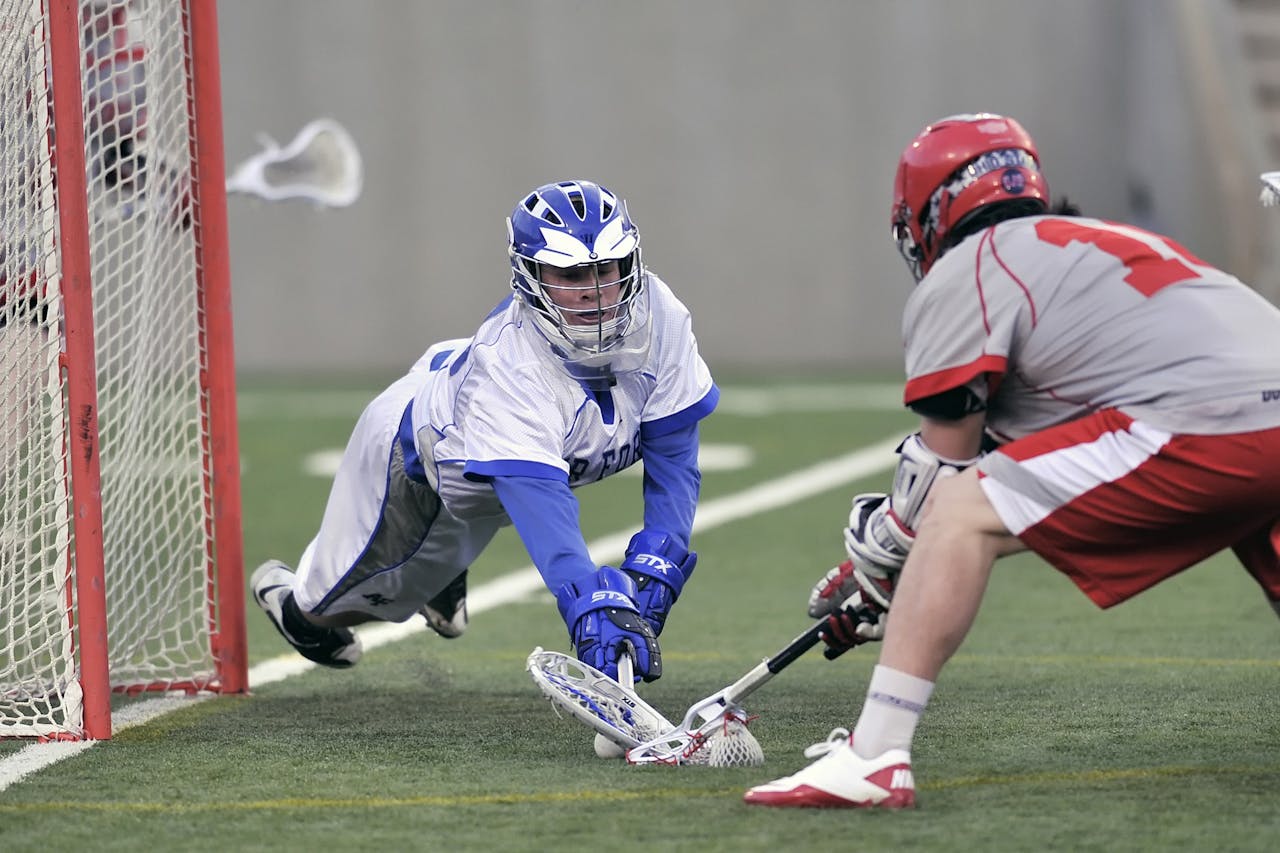 creative-02 Dynamic scene of a lacrosse game with athletes in action, highlighting intense competition.