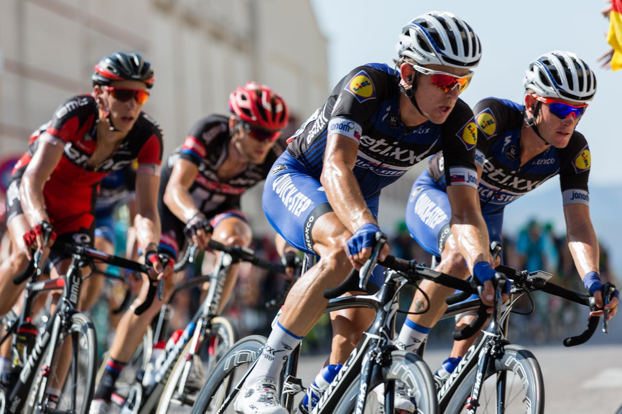 creative Competitive cyclists in a high-speed race, showcasing athleticism and teamwork.