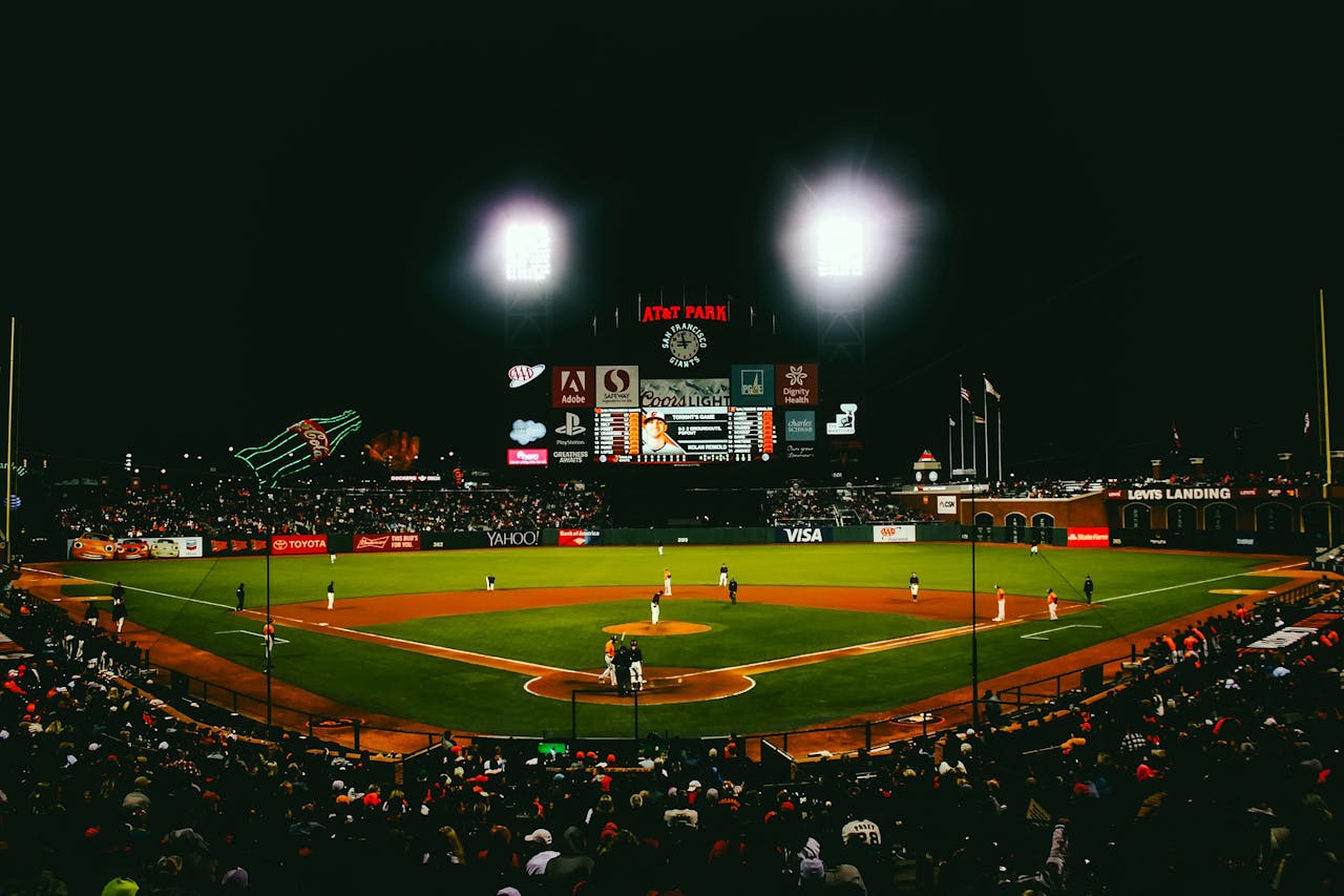 brand-02 Exciting evening baseball game with fans at AT&T Park stadium under bright lights.