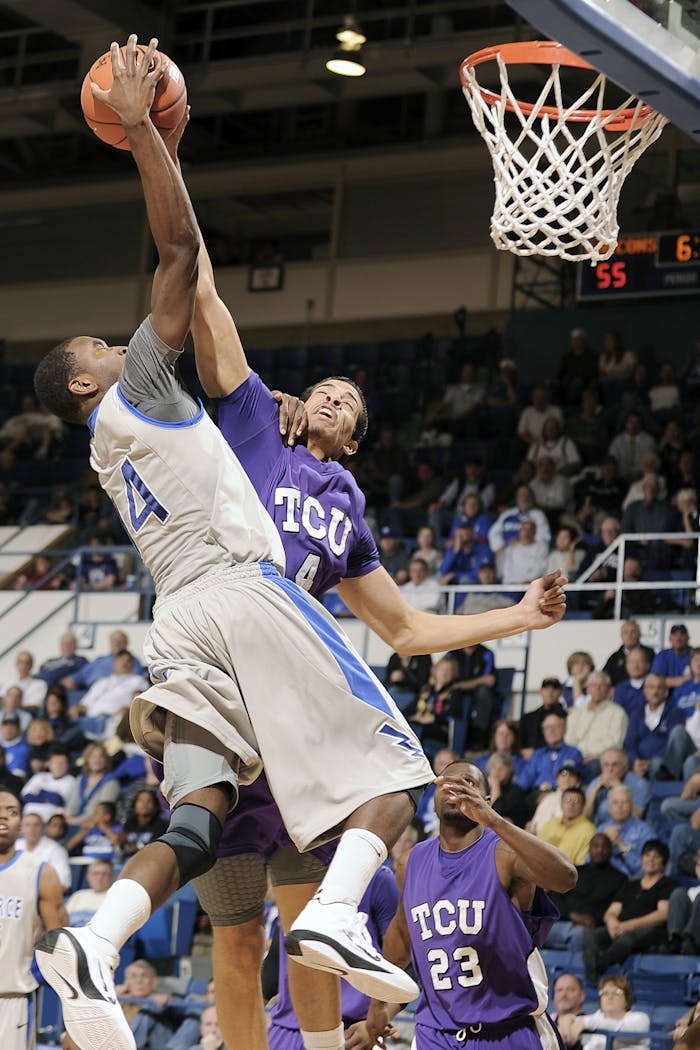 our-story Players from two college teams compete fiercely for a basket during a lively game.